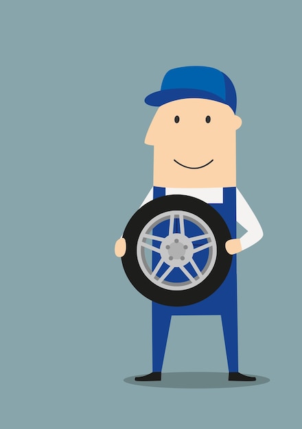 Happy car mechanic with wheel