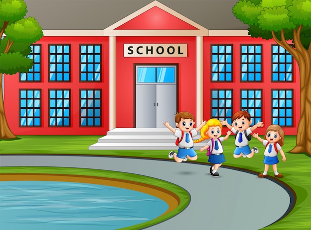 Bambini felici in uniforme con lo zaino che va a scuola