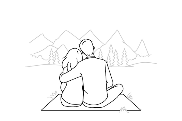 Happy couple hugging in mountains together