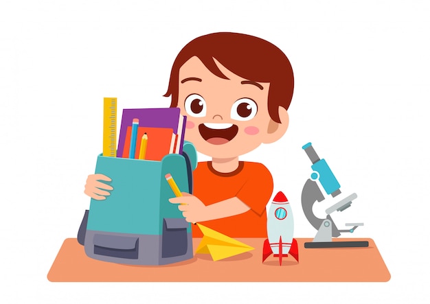 Happy cute kid boy study on cute table