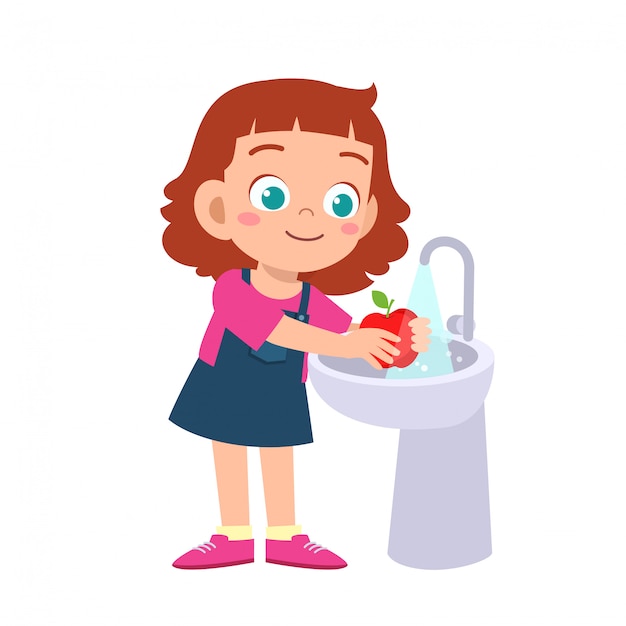 Happy cute kid girl wash vegetable fruit clean