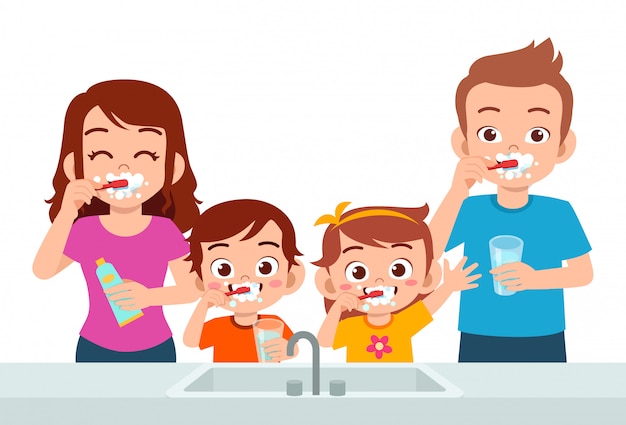 Happy cute kids boy and girl brush teeth with parent