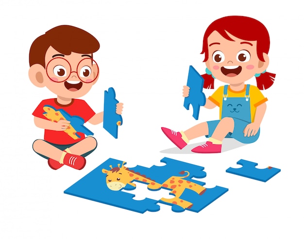 Happy cute little kid boy and girl play jigsaw puzzle