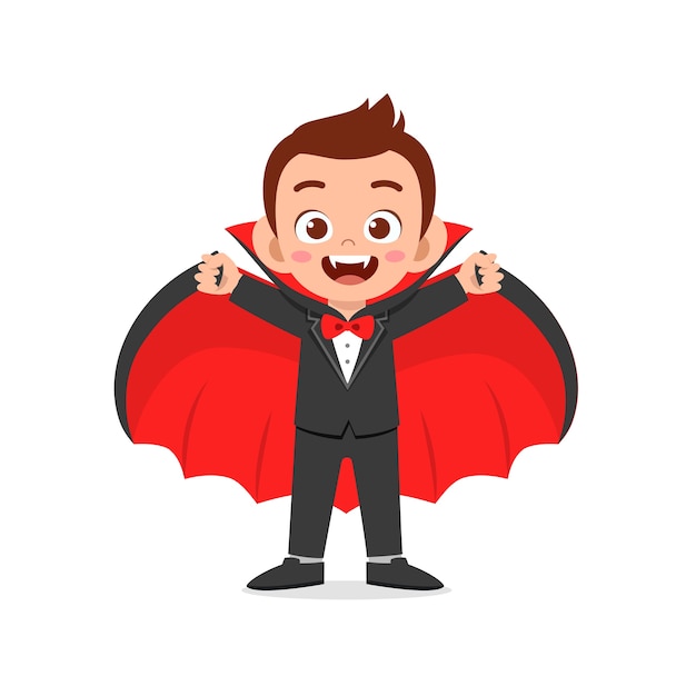 Happy cute little kid celebrate halloween wears dracula vampire costume with cape