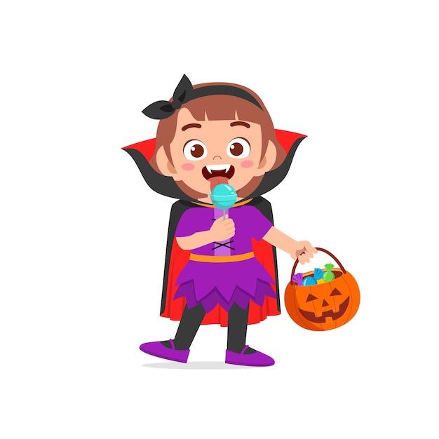 Happy cute little kid celebrate halloween wears dracula vampire costume with cape