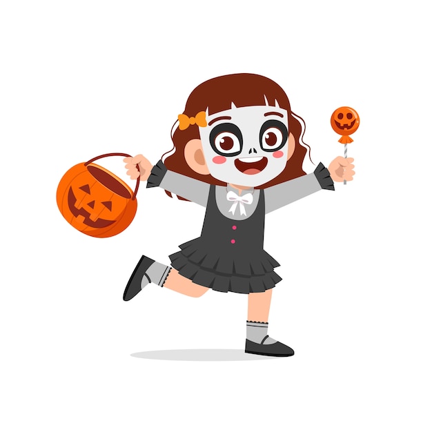 幸せなかわいい子供がハロウィーンを祝うスケルトンコスチュームを着て