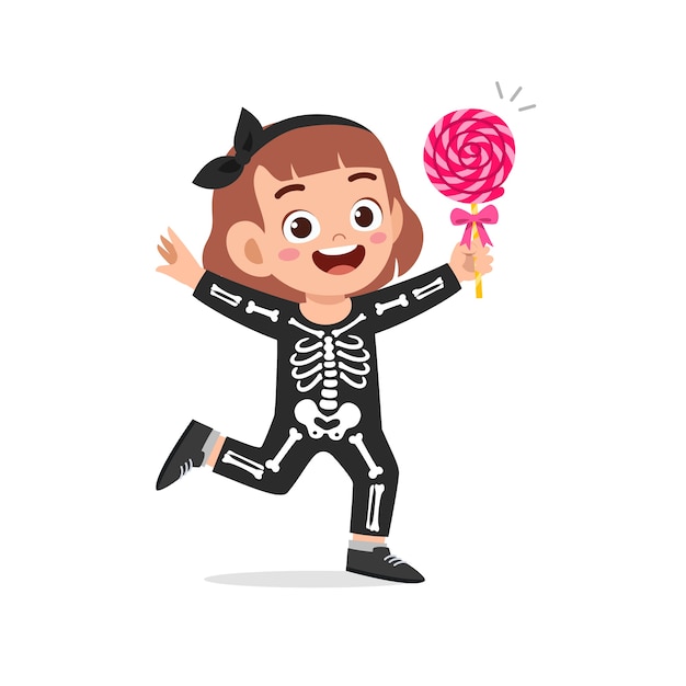 Happy cute little kid celebrate halloween wears skeleton costume