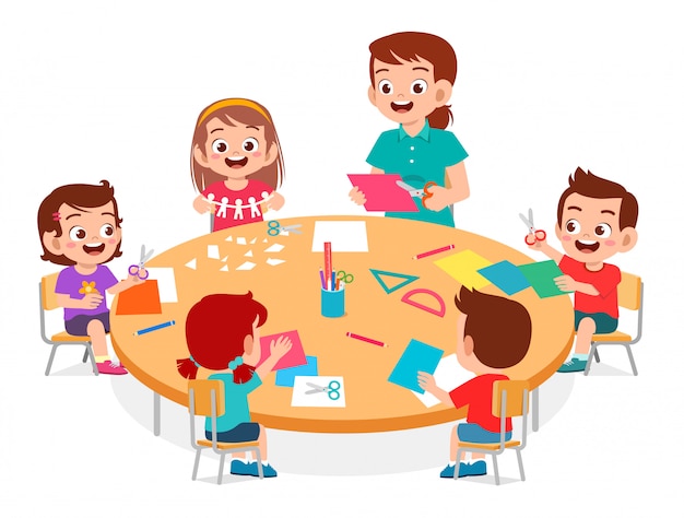 Happy cute little kids boy and girl make paper craft with teacher