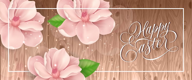 Happy Easter lettering in frame with pink blossoms and glittering on wooden background.