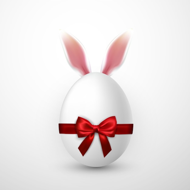 Happy Easter with Easter egg with red bow and Easter Bunny ears