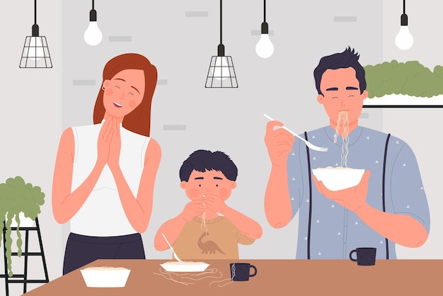 Happy family people eat pasta spaghetti or noodles cute family home scene in kitchen