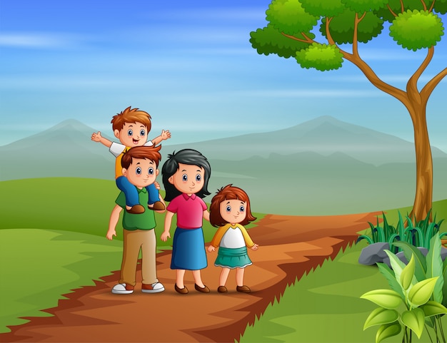Счастливая семья гуляет на холме