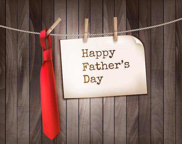 Happy father's day background with a red tie on a wood