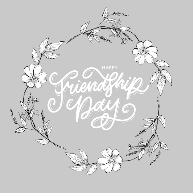 Happy friendship day handwritten lettering with floral wreath