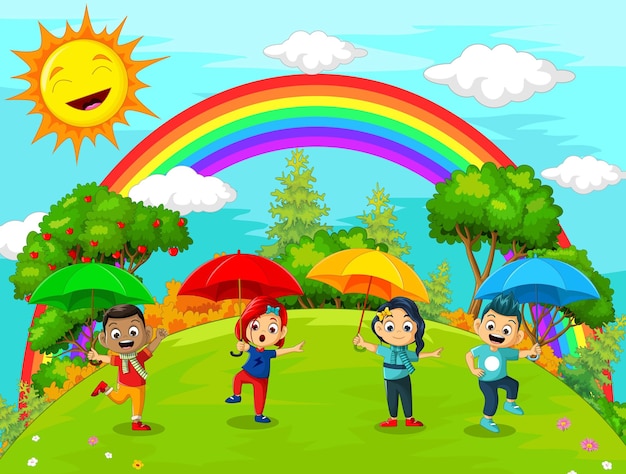 傘を持った子供たちの幸せなグループ