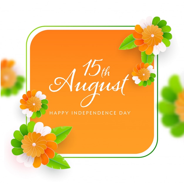 Happy independence day font on saffron and white background decorated with paper flowers.
