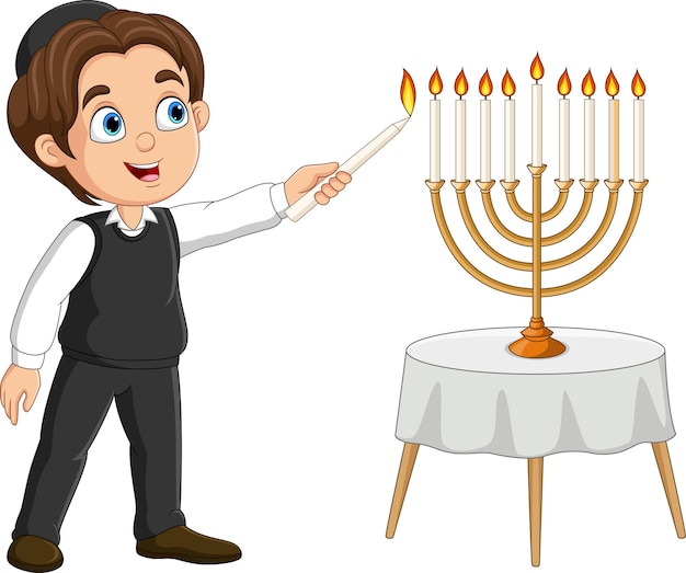 Happy jewish boy lights hanukkah candles