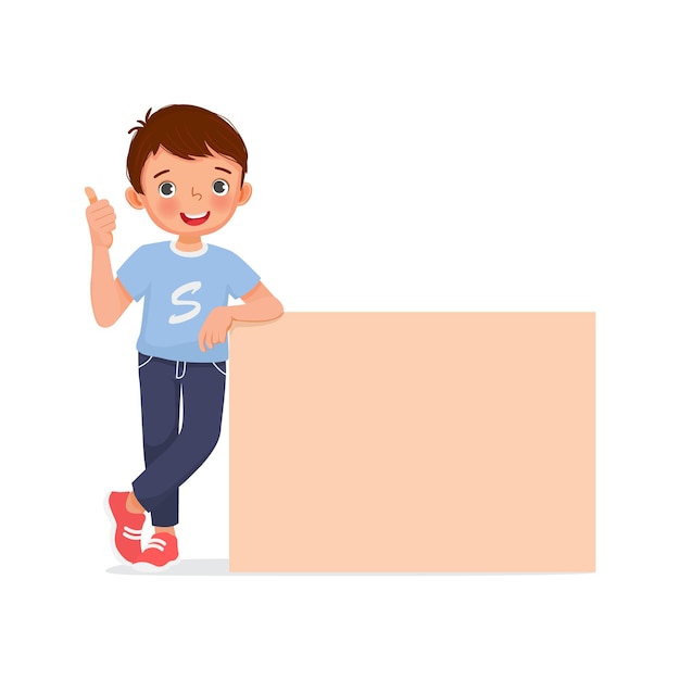 Happy little boy leaning on empty poster or signboard showing thumb up gesture