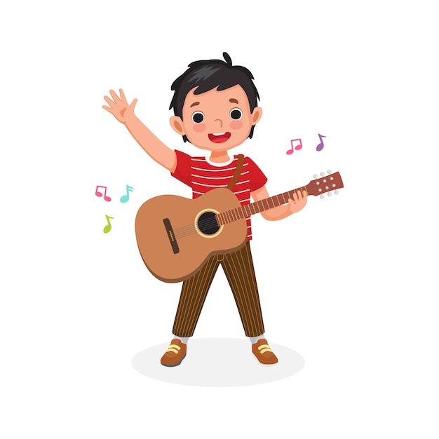 Happy little boy playing and holding a guitar singing and waving his hand smiling