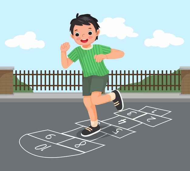 happy little boy playing hopscotch drawn with chalk outside on playground street at the park