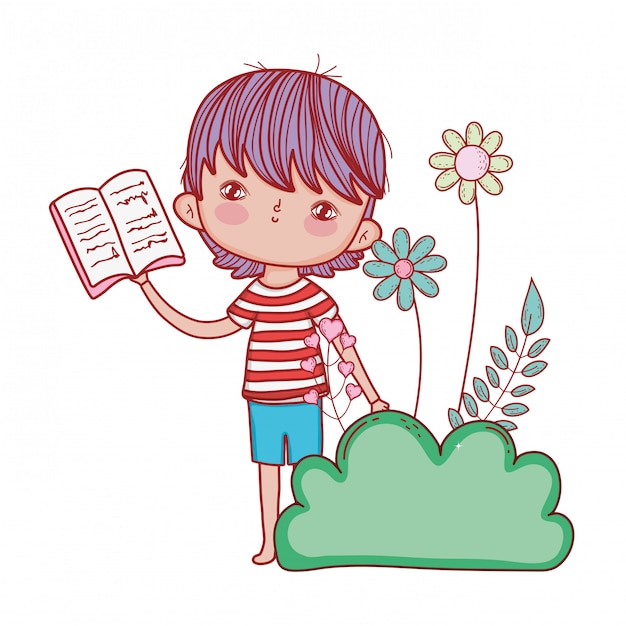 Happy little boy reading book in the garden