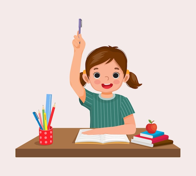 happy little girl student rising hand answering question sitting at her desk in the classroom