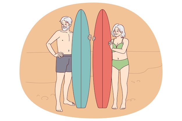 Happy mature people with surfboard