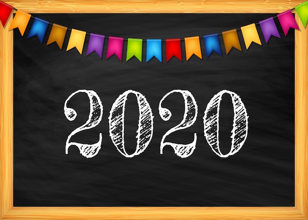 Happy new year 2020 text on blackboard.