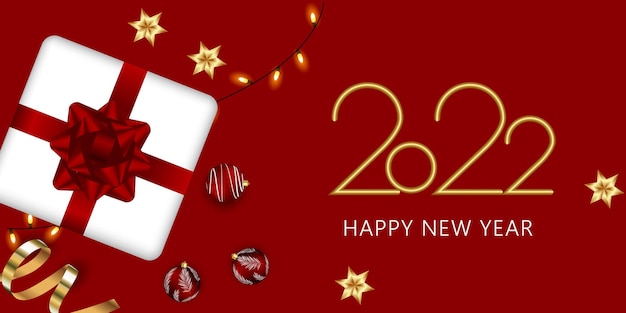 Happy new year 2022 elegant golden text with gift and confetti.