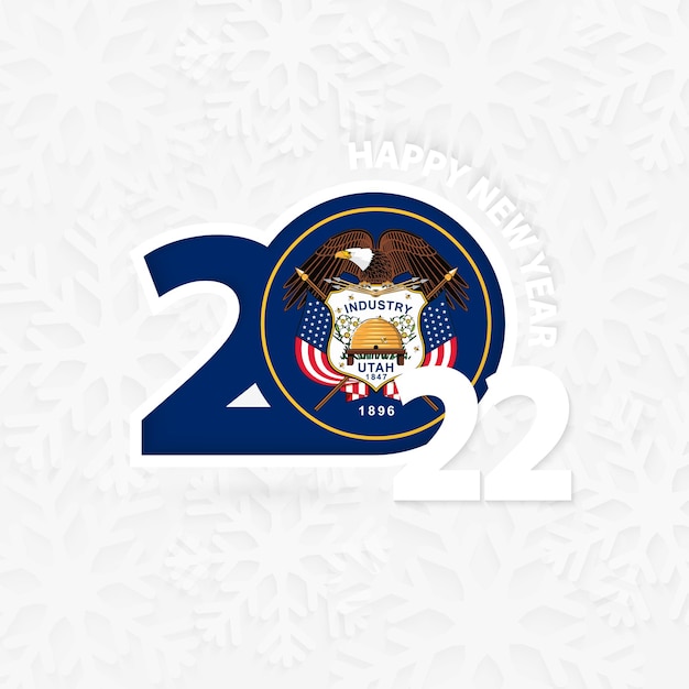 雪の結晶の背景にユタ州の新年あけましておめでとうございます2022。