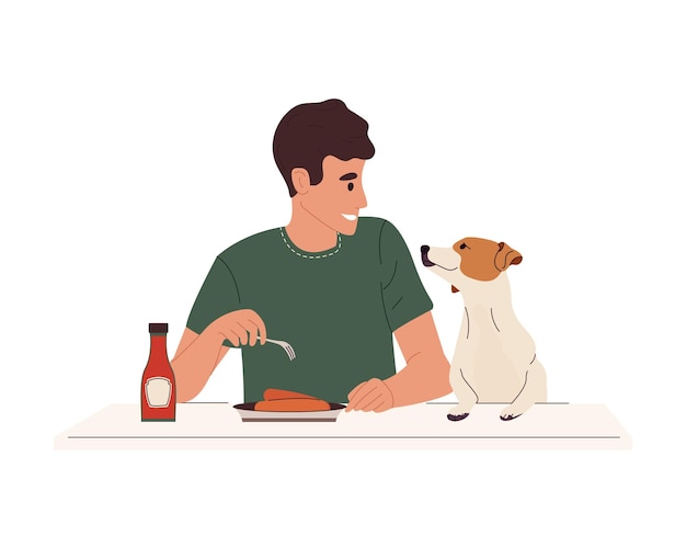 Happy person pet owner sitting at table with dog, eating food. pet asks for a sausage from man