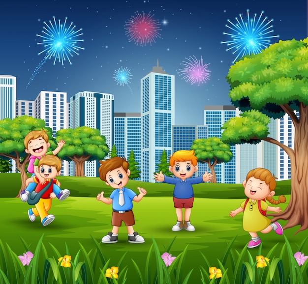 Happy school children on the city park with firework