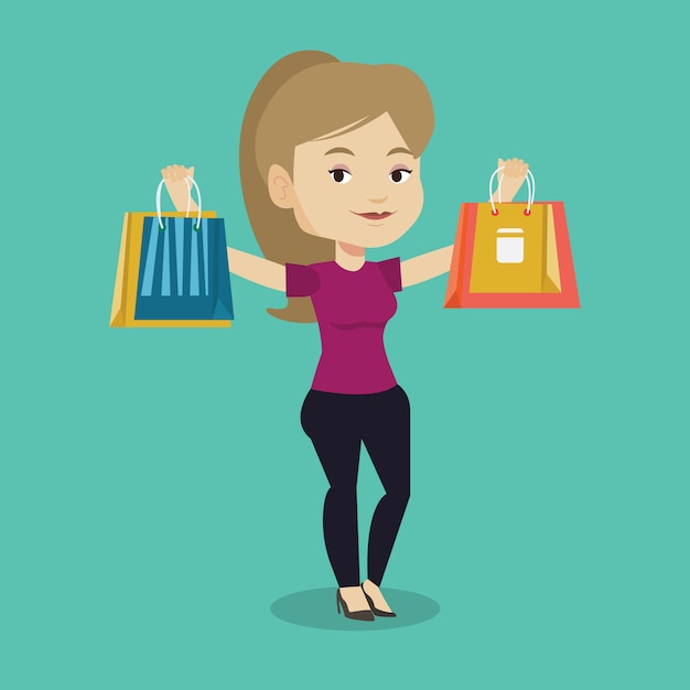 Happy woman holding shopping bags.