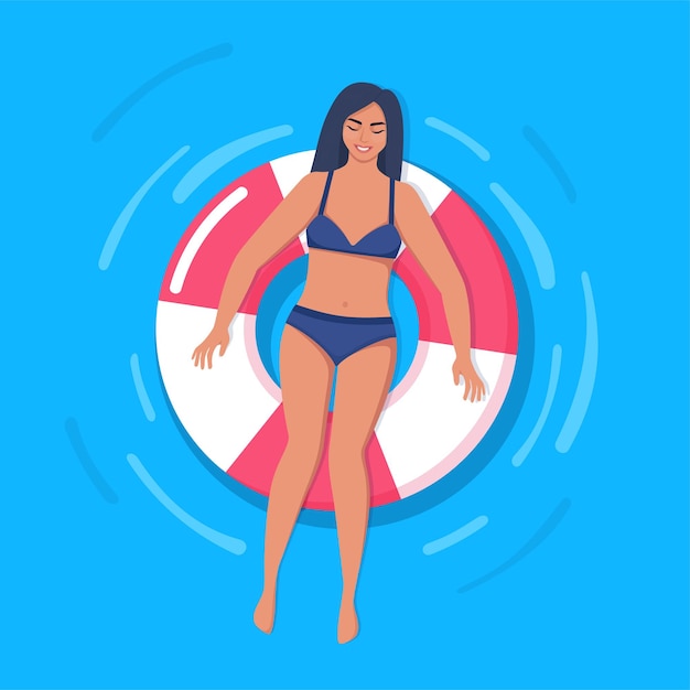 Happy woman in swimsuit floating on rubber ring in swimming pool or in the sea