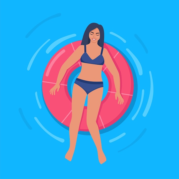 Happy woman in swimsuit floating on rubber ring in swimming pool or in the sea