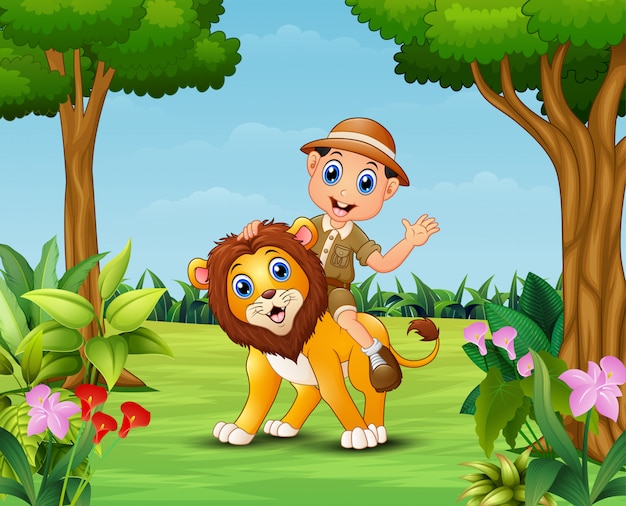 Счастливый зоопарк мальчик и лев в прекрасном саду