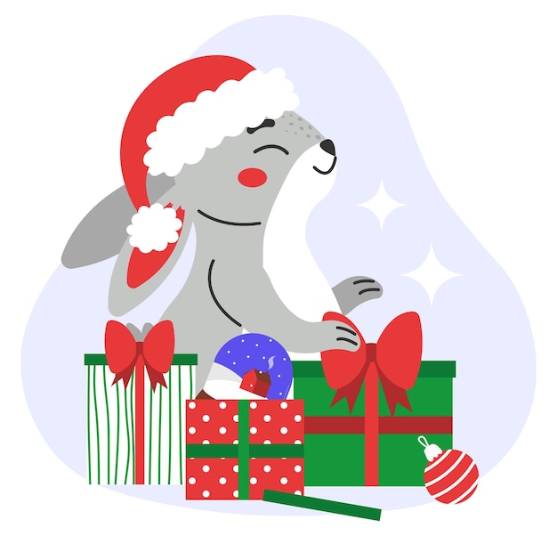 The hare with a santa hat sits among christmas presents.