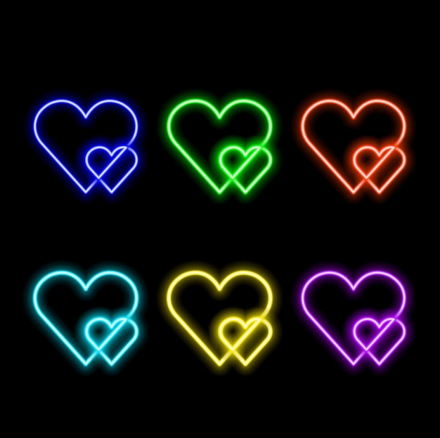 Hartvormige rode neonlicht op zwarte muur