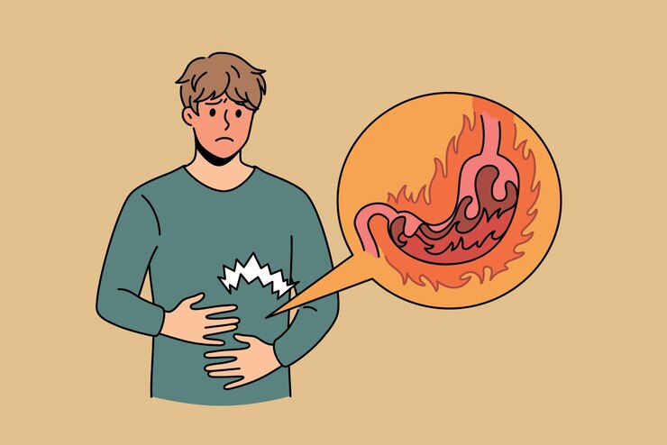 Vector heartburn and digestive problems concept. young stressed man cartoon character standing touching stomach feeling burn pain and uncomfortable inside vector illustration