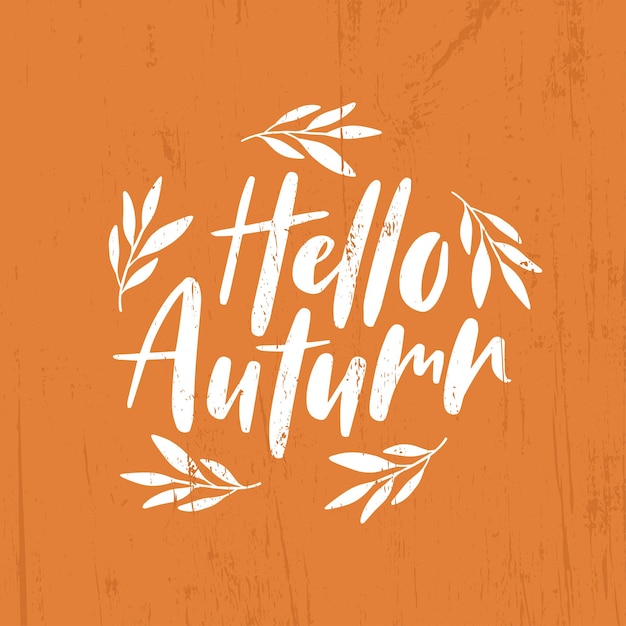 Vector hello autumn lettering quote with september leaves.