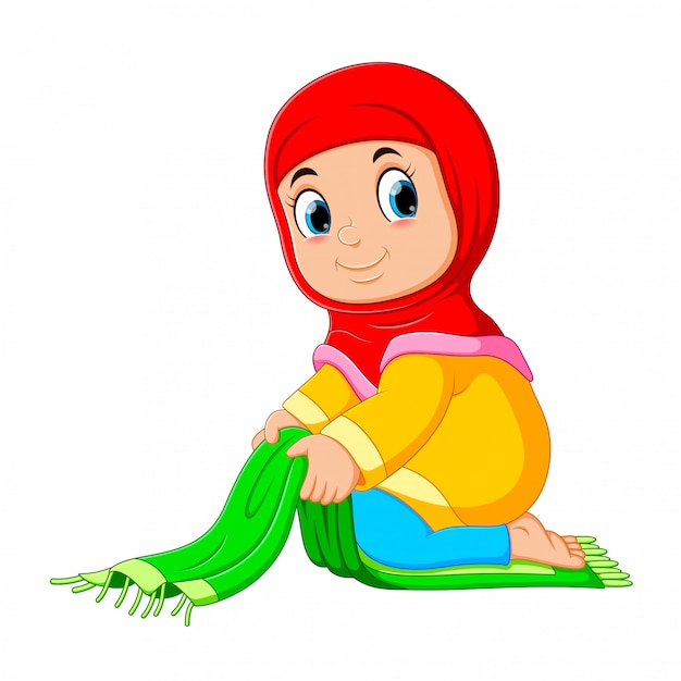 Het deligent meisje vouwt haar groene gebedskleed dicht