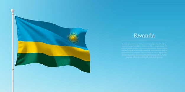 Het zwaaien van de vlag van Rwanda tegen de heldere blauwe lucht Copyspace