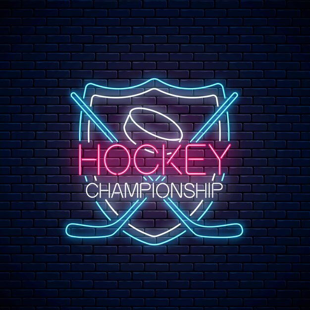 Insegna al neon di campionato di hockey con bastoni da hockey e disco.