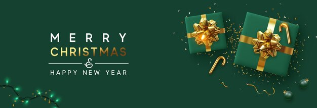 Holiday background Merry Christmas and Happy New Year. Xmas design with realistic festive objects, sparkling lights garland, green gift box, ball bauble, glitter gold confetti. Horizontal banner