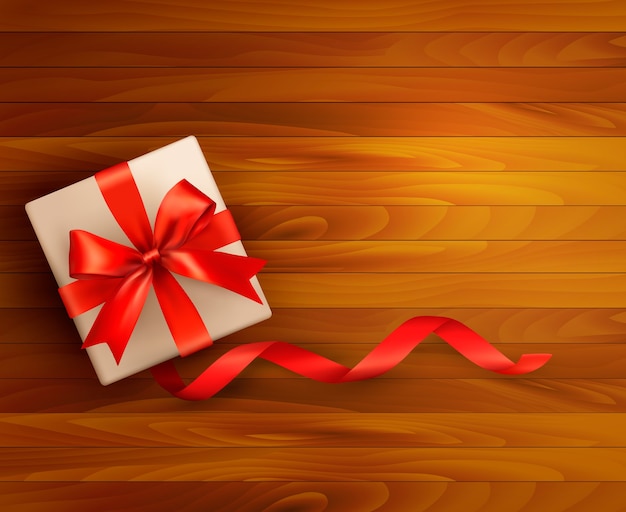 Vector holiday background with gift box and red ribbons