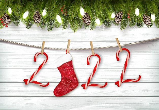 Holiday Christmas background with branch of tree and christmas candy cane, a red socket on the rope. Vector