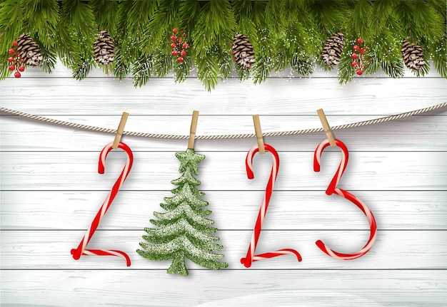 Vector holiday merry christmas and happy new year background with branch of tree and christmas candy cane tree on the rope vector