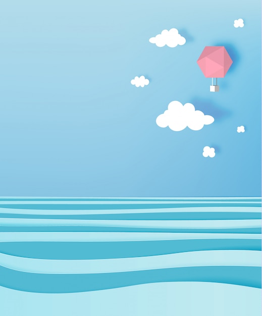 Hot air balloon paper art style with pastel sky and ocean background