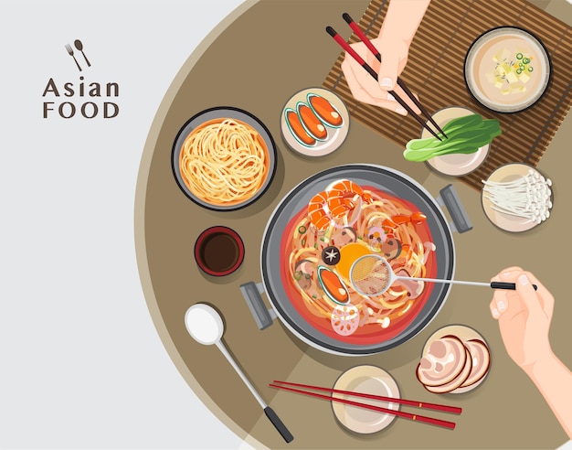 レストランの鍋、しゃぶしゃぶを食べる箸を持っている手