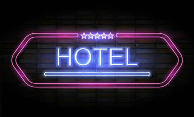 Hotel neon sign on brick wall